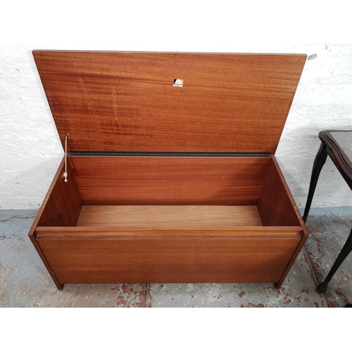 83 - Four pieces of furniture comprising mahogany nest of three tables, Avalon teak blanket box, oak bure... 