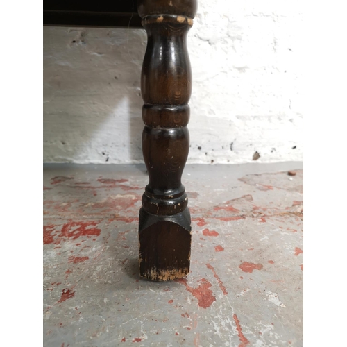 85 - An oak side cabinet with two doors and upper drawer - approx. 73cm high x 61cm wide x 32cm deep