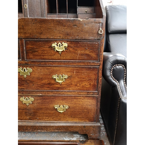 94 - A George III oak bureau - approx. 102cm high x 87cm wide x 50cm deep