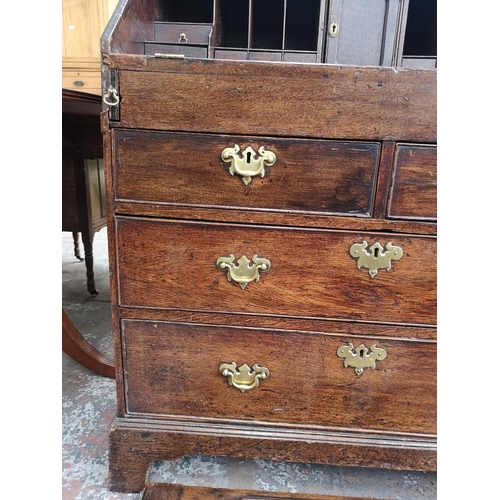 94 - A George III oak bureau - approx. 102cm high x 87cm wide x 50cm deep