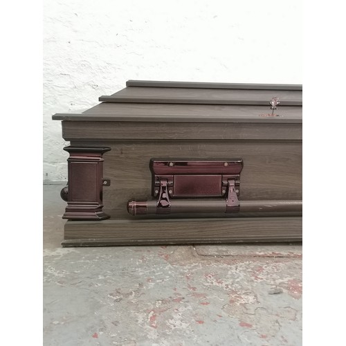 15 - A South African oak effect casket - approx. 48cm high x 205cm wide x 60cm deep