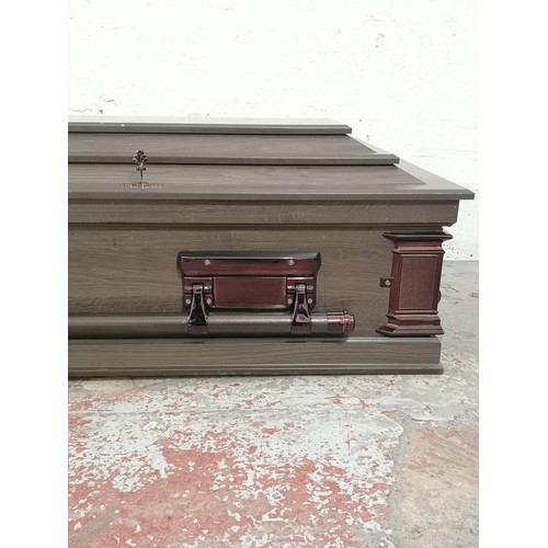 15 - A South African oak effect casket - approx. 48cm high x 205cm wide x 60cm deep