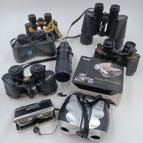 244 - Eight optical instruments to include boxed Seal radio binoculars, Bushnell Expo thumb focus binocula... 