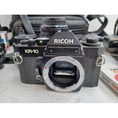 245 - A collection of camera equipment to include cased 1980s Ricoh KR-10 35mm SLR camera, Mitakon MC 1:3.... 