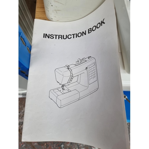A cased Jenome XC33 special edition computerized sewing machine with