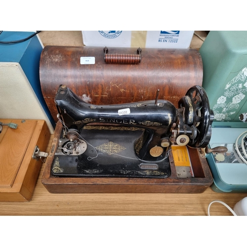 A cased Singer hand crank sewing machine serial no. Y3840952