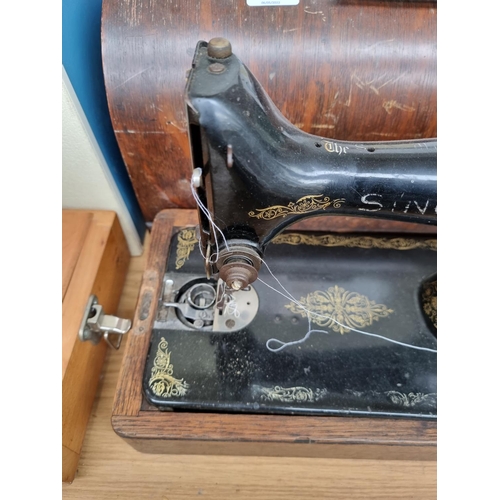 A cased Singer hand crank sewing machine serial no. Y3840952