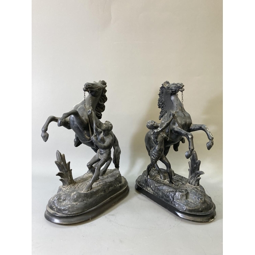 1680 - A pair of black painted spelter man and rearing horse figurines on wooden plinths - approx. 14cm hig... 