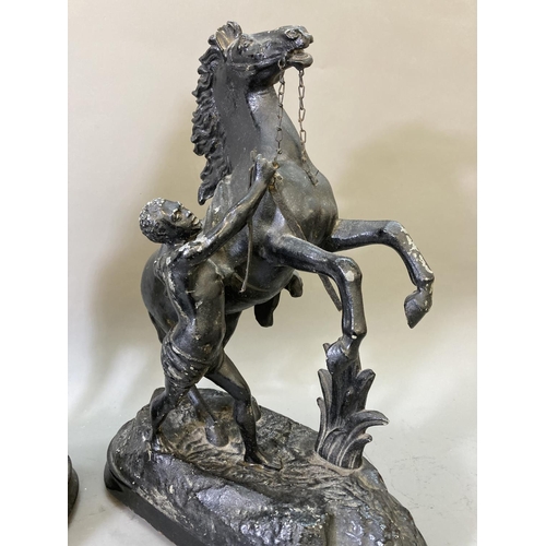 1680 - A pair of black painted spelter man and rearing horse figurines on wooden plinths - approx. 14cm hig... 