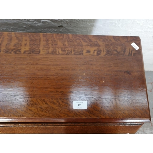 155 - A mid/late 20th century oak bureau with three drawers, fall front and cabriole supports - approx. 10... 