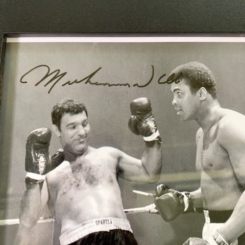 168 - A framed black and white photograph of Muhammad Ali and Rocky Marciano with printed autographs - app... 