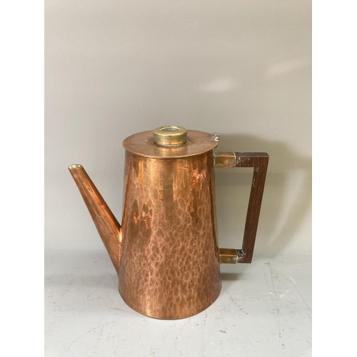 63 - A collection of copper and brassware to include a pair of 16cm candlesticks, kettle, ashtrays etc.