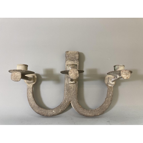 64 - A pair of cast iron three branch wall sconces - approx. 23cm high x 31cm wide