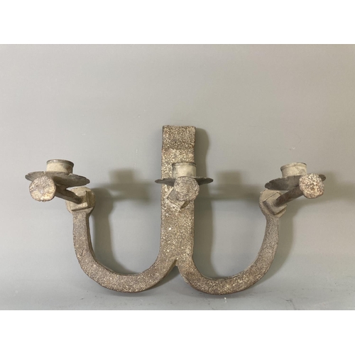 64 - A pair of cast iron three branch wall sconces - approx. 23cm high x 31cm wide