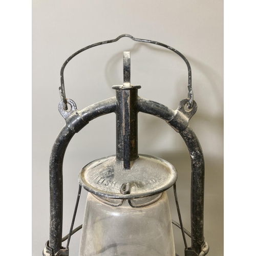 68 - Two vintage storm lanterns, one British made approx. 40cm high and one Dietz approx. 35cm high