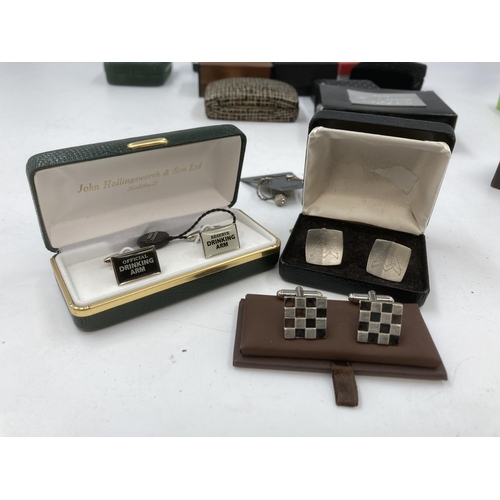 128 - A collection of boxed cufflinks to include mid 20th century 835 silver etc.