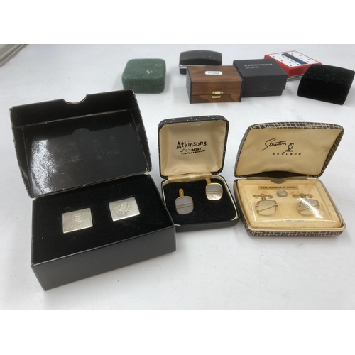 128 - A collection of boxed cufflinks to include mid 20th century 835 silver etc.