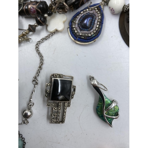 160 - A collection of assorted costume jewellery to include hallmarked sterling silver and enamel floral p... 