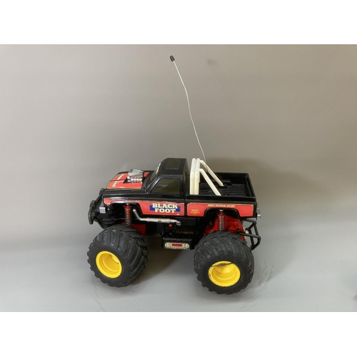 80 - A Tamiya 1/14 scale Blackfoot remote control plastic model monster truck with remote