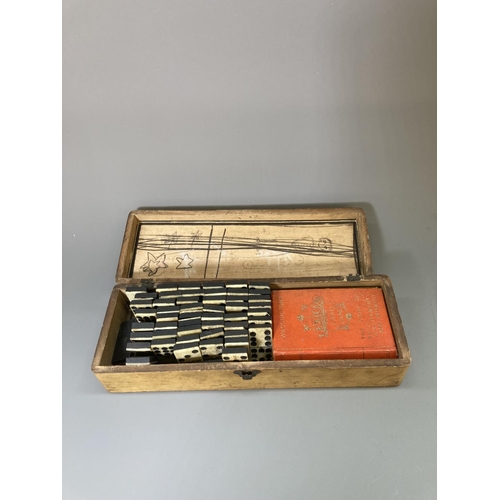 83 - A late 19th/early 20th century Mauchline ware glove box containing vintage bone and ebony dominoes a... 