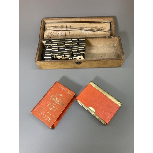 83 - A late 19th/early 20th century Mauchline ware glove box containing vintage bone and ebony dominoes a... 