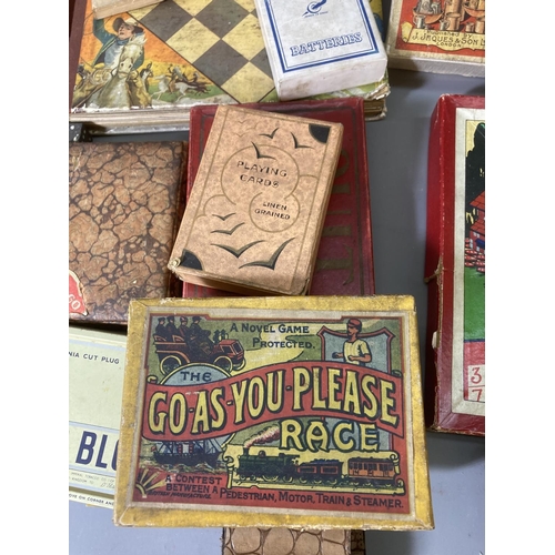 85 - A large collection of assorted vintage games to include Jaques & Son Tiddledy Winks, Railway Race, p... 