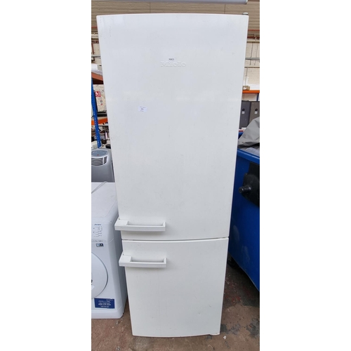 675 - A Miele upright fridge freezer - approx. 182cm high