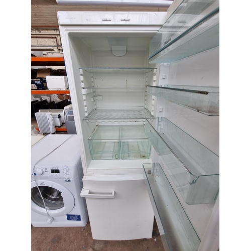 675 - A Miele upright fridge freezer - approx. 182cm high