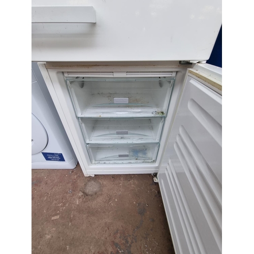 675 - A Miele upright fridge freezer - approx. 182cm high