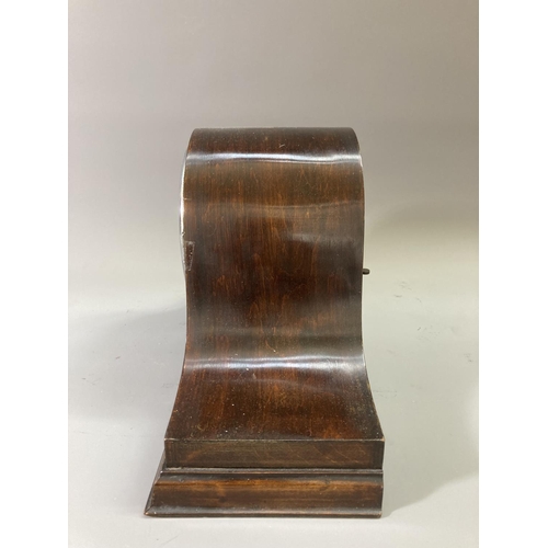 218 - A mid 20th century mahogany cased chiming mantel clock with pendulum - approx. 23cm high x 43cm wide... 