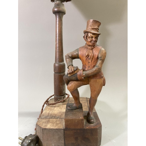 223 - A vintage carved hardwood novelty table lamp featuring lamp post and Sam Weller cleaning boot - appr... 