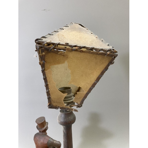 223 - A vintage carved hardwood novelty table lamp featuring lamp post and Sam Weller cleaning boot - appr... 