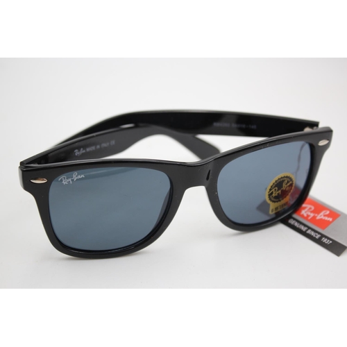 136 - A boxed pair of Ray-Ban black framed Wayfarer sunglasses