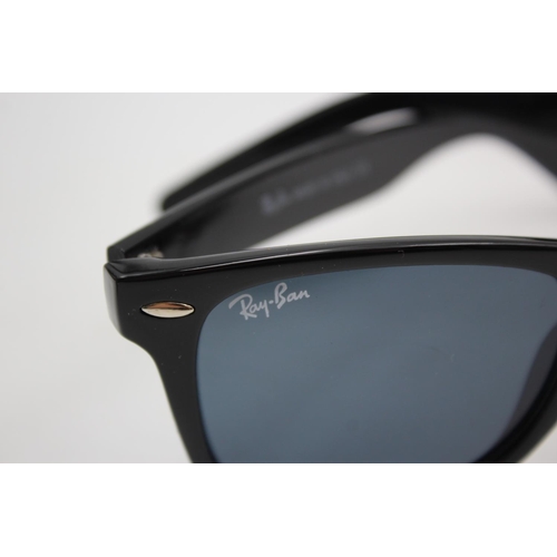 136 - A boxed pair of Ray-Ban black framed Wayfarer sunglasses