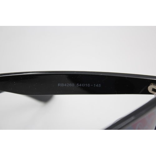 136 - A boxed pair of Ray-Ban black framed Wayfarer sunglasses