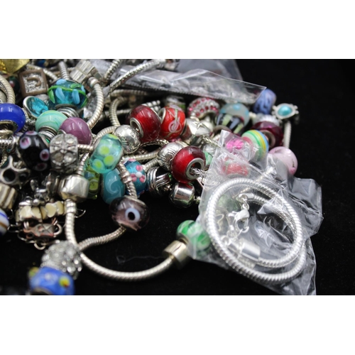 142 - Forty two retro fashion charm bracelets