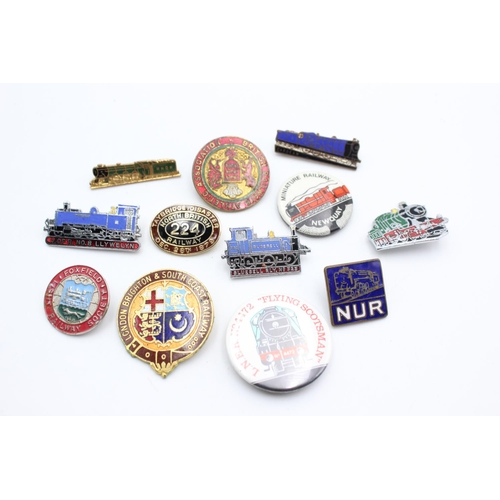 1431 - Twelve assorted vintage rail/railway related pin badges