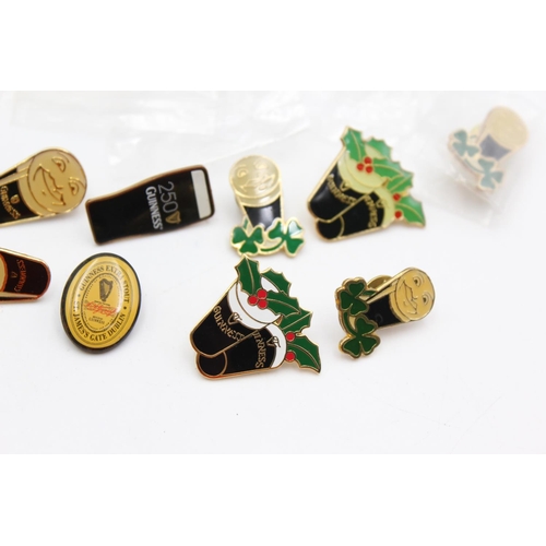 1438 - Fourteen assorted Guiness advertising pin badges and one pen knife