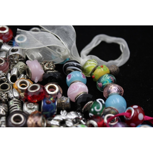 154 - Approx. 550g of contemporary fashion charms