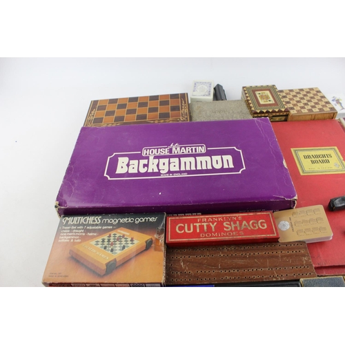 69 - A collection of assorted playing cards and games to include cribbage, dice, dominoes etc.