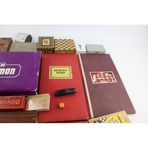 69 - A collection of assorted playing cards and games to include cribbage, dice, dominoes etc.