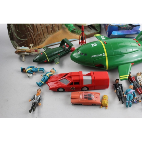 77 - A collection of assorted Gerry Anderson toys to include Thunderbirds, Tracy Island, figures etc.