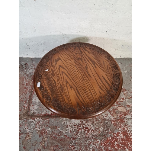 416 - A Jay-Cee solid oak circular coffee table - approx. 47cm high x 75cm diameter