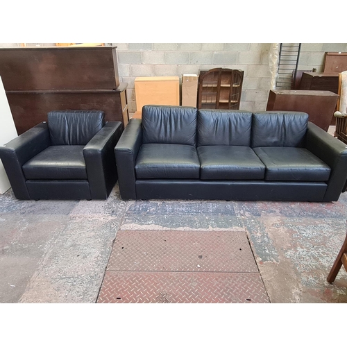 422 - A modern black leather two piece lounge suite comprising armchair - approx. 72cm high x 95cm wide x ... 