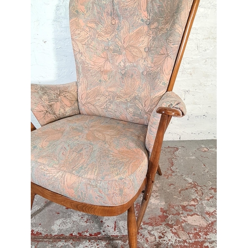 423 - An Ercol Evergreen Golden Dawn elm armchair - approx. 104cm high x 74cm wide x 60cm deep