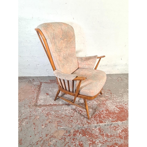 423 - An Ercol Evergreen Golden Dawn elm armchair - approx. 104cm high x 74cm wide x 60cm deep