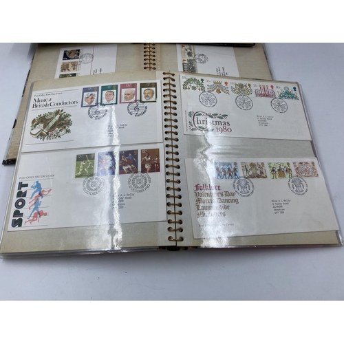 170 - Three albums containing assorted First Day covers to include British gardens, London economic summit... 