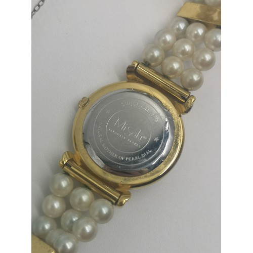 1257 - A boxed Misaki Japanese pearl and gold plated quartz wristwatch with mother of pearl dial