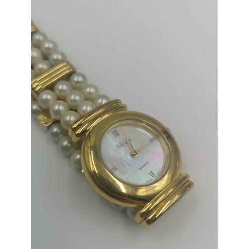 1257 - A boxed Misaki Japanese pearl and gold plated quartz wristwatch with mother of pearl dial