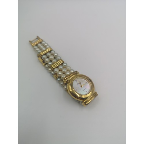 1257 - A boxed Misaki Japanese pearl and gold plated quartz wristwatch with mother of pearl dial